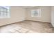 Bright bedroom with natural light, wood-look floors, and views of trees through the double windows at 7009 New Town Rd, Waxhaw, NC 28173