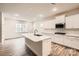 Modern kitchen with white cabinets, a center island, stainless steel appliances, and recessed lighting at 7009 New Town Rd, Waxhaw, NC 28173