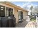 This back deck features weathered wood, access to the house, and a grill at 8224 Park Vista Cir, Charlotte, NC 28226