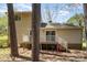 Back exterior of home featuring access to a wooden deck and stair access to the backyard at 8224 Park Vista Cir, Charlotte, NC 28226