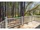 The backyard deck overlooks a wooded and grassy yard at 8224 Park Vista Cir, Charlotte, NC 28226