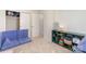 Bedroom with modular sofa, shelving, and a doorway to another room at 8224 Park Vista Cir, Charlotte, NC 28226