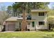 Charming two-story home with a brick chimney and a well-manicured front lawn at 8224 Park Vista Cir, Charlotte, NC 28226