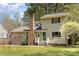 Charming two-story home with a brick chimney, attached garage, and well-maintained lawn at 8224 Park Vista Cir, Charlotte, NC 28226