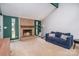 A well-lit living room featuring a brick fireplace and comfortable blue sofa at 8224 Park Vista Cir, Charlotte, NC 28226