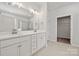 Bathroom featuring double sinks, quartz countertop, and a walk-in closet at 896 Exeter Dr, Sherrills Ford, NC 28673