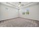 Spacious bedroom with tray ceilings, a ceiling fan, and plenty of natural light at 896 Exeter Dr, Sherrills Ford, NC 28673