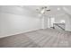 Spacious bonus room with plush carpeting and a ceiling fan, offering flexible living or entertainment space at 896 Exeter Dr, Sherrills Ford, NC 28673