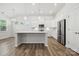Bright kitchen featuring white cabinets, stainless steel appliances, and a center island at 896 Exeter Dr, Sherrills Ford, NC 28673