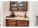 Dry bar area features granite countertops, wine rack, and glass cabinets at 9011 Pine Laurel Dr, Weddington, NC 28104