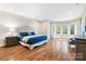 Expansive bedroom with bay windows, hardwood floors, and elegant finishes at 9011 Pine Laurel Dr, Weddington, NC 28104