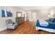 Cozy bedroom with wood floors, sitting area, and plenty of natural light at 9011 Pine Laurel Dr, Weddington, NC 28104