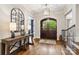 Elegant foyer with hardwood floors, large mirror, and decorative lighting at 9011 Pine Laurel Dr, Weddington, NC 28104