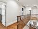 Spacious hallway with hardwood floors, neutral paint, and natural lighting at 9011 Pine Laurel Dr, Weddington, NC 28104