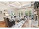Bright living room with fireplace, coffered ceiling, and hardwood floors at 9011 Pine Laurel Dr, Weddington, NC 28104