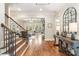 Elegant living room with hardwood floors, coffered ceiling, and french doors at 9011 Pine Laurel Dr, Weddington, NC 28104