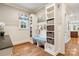 Well-organized mudroom area with seating, storage cubbies, hooks, and natural light at 9011 Pine Laurel Dr, Weddington, NC 28104