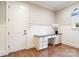 Stylish office space features built-in desk, wainscoting, and natural light at 9011 Pine Laurel Dr, Weddington, NC 28104