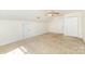 Upstairs bedroom with vaulted ceiling, neutral walls and carpet, and a ceiling fan at 10429 Madison Park Dr, Charlotte, NC 28269