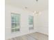 Dining room with hardwood floors and modern chandelier at 10429 Madison Park Dr, Charlotte, NC 28269