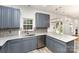 Stylish kitchen with gray cabinets, granite countertops, stainless steel appliances and a window above the sink at 10429 Madison Park Dr, Charlotte, NC 28269
