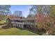Back of the home featuring a large deck and well-maintained lawn and garden at 118 Lakewood Dr, Kings Mountain, NC 28086