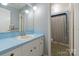 Cozy bathroom featuring a single sink vanity and bathtub with shower at 118 Lakewood Dr, Kings Mountain, NC 28086