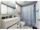Bathroom with updated sink, vanity, and tile backsplash, tub with shower at 118 Lakewood Dr, Kings Mountain, NC 28086