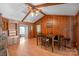Cozy dining room with paneled walls, a beamed ceiling, and a view to the living room at 118 Lakewood Dr, Kings Mountain, NC 28086