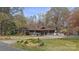 Lovely home with mature trees, spacious yard, two car garage, and inviting curb appeal at 118 Lakewood Dr, Kings Mountain, NC 28086