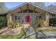 Close-up of the beautiful stone home with a covered entry and a striking red front door at 118 Lakewood Dr, Kings Mountain, NC 28086