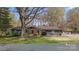 Beautiful home with stone facade, lush lawn, mature trees and inviting curb appeal at 118 Lakewood Dr, Kings Mountain, NC 28086