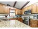 Updated kitchen featuring stainless appliances, granite counters, and wood cabinets at 118 Lakewood Dr, Kings Mountain, NC 28086