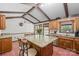 Open kitchen features granite counters, wood cabinets and an island with seating at 118 Lakewood Dr, Kings Mountain, NC 28086