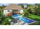 Aerial view of the backyard with in-ground pool, lounge chairs, and lush landscaping at 125 Trent Pines Dr, Mooresville, NC 28117