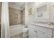 Well-lit bathroom with a granite countertop, a tiled shower-tub, and a modern vanity at 125 Trent Pines Dr, Mooresville, NC 28117