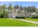 Charming two-story home boasts lush landscaping, attached garage and well manicured lawn at 125 Trent Pines Dr, Mooresville, NC 28117