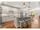 Bright kitchen with modern appliances, island with seating, and hardwood floors at 125 Trent Pines Dr, Mooresville, NC 28117