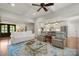 Spacious living room with hardwood floors, fireplace, with easy access to kitchen at 125 Trent Pines Dr, Mooresville, NC 28117