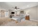 Spacious main bedroom suite with a sitting area and ceiling fan for added comfort at 125 Trent Pines Dr, Mooresville, NC 28117