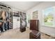 Spacious walk-in closet with custom shelving, carpet, and natural light at 125 Trent Pines Dr, Mooresville, NC 28117