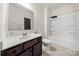 Bathroom with a single sink vanity with dark wood cabinets and a bath tub at 1268 Scotch Meadows Loop, Monroe, NC 28110
