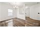 Open-concept dining room with wood floors, chandelier, and seamless access to other areas at 1268 Scotch Meadows Loop, Monroe, NC 28110