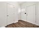 Bright entryway features wood floors, a front door, and access to additional rooms at 1268 Scotch Meadows Loop, Monroe, NC 28110