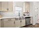 Beautiful kitchen with stainless steel appliances, a farmhouse sink, and ample cabinet space at 1268 Scotch Meadows Loop, Monroe, NC 28110