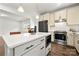 Open concept kitchen has a large island with seating, modern appliances, and sleek cabinets at 1268 Scotch Meadows Loop, Monroe, NC 28110