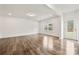 Spacious living room with wood floors, natural light, and easy access to the backyard at 1268 Scotch Meadows Loop, Monroe, NC 28110