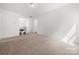 Upstairs loft area with neutral carpet and lots of open space at 1268 Scotch Meadows Loop, Monroe, NC 28110