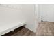 Bright mudroom with wood floors, coat hooks and convenient built-in bench seating at 1268 Scotch Meadows Loop, Monroe, NC 28110
