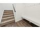 Entry area with staircase, built-in bench and coat hooks at 1268 Scotch Meadows Loop, Monroe, NC 28110